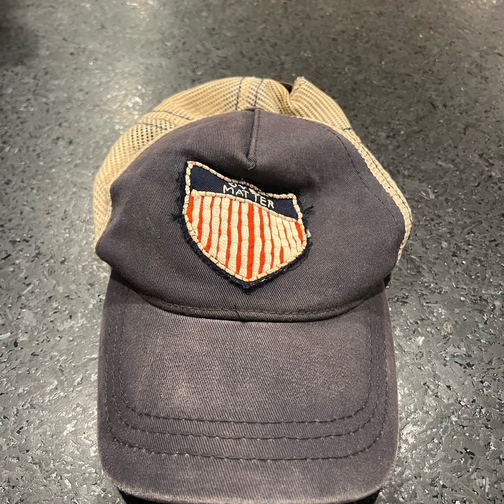 Navy Blue and Tan Trucker hat with Mind Over Matter Patch